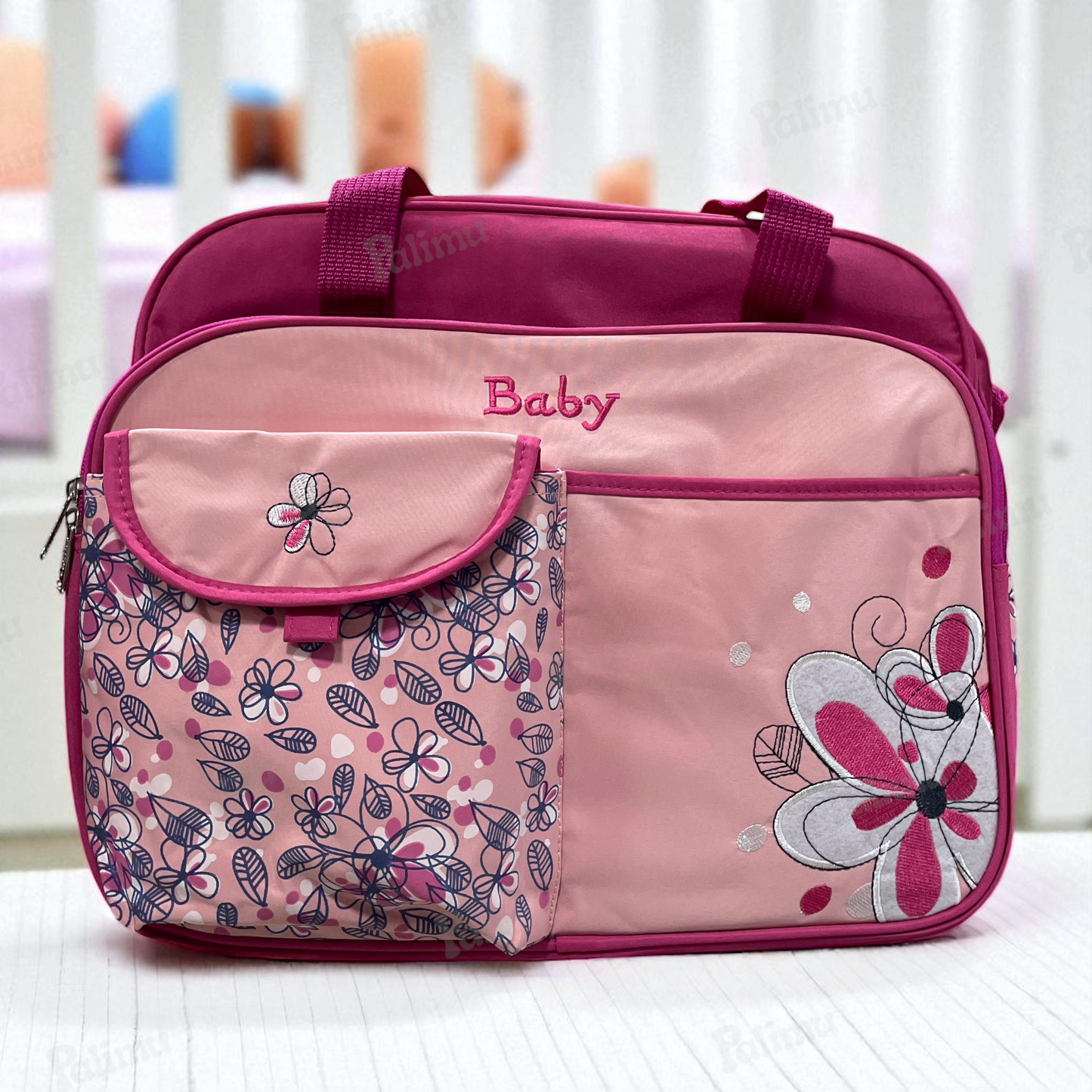 Bolso maternal floreado fucsia