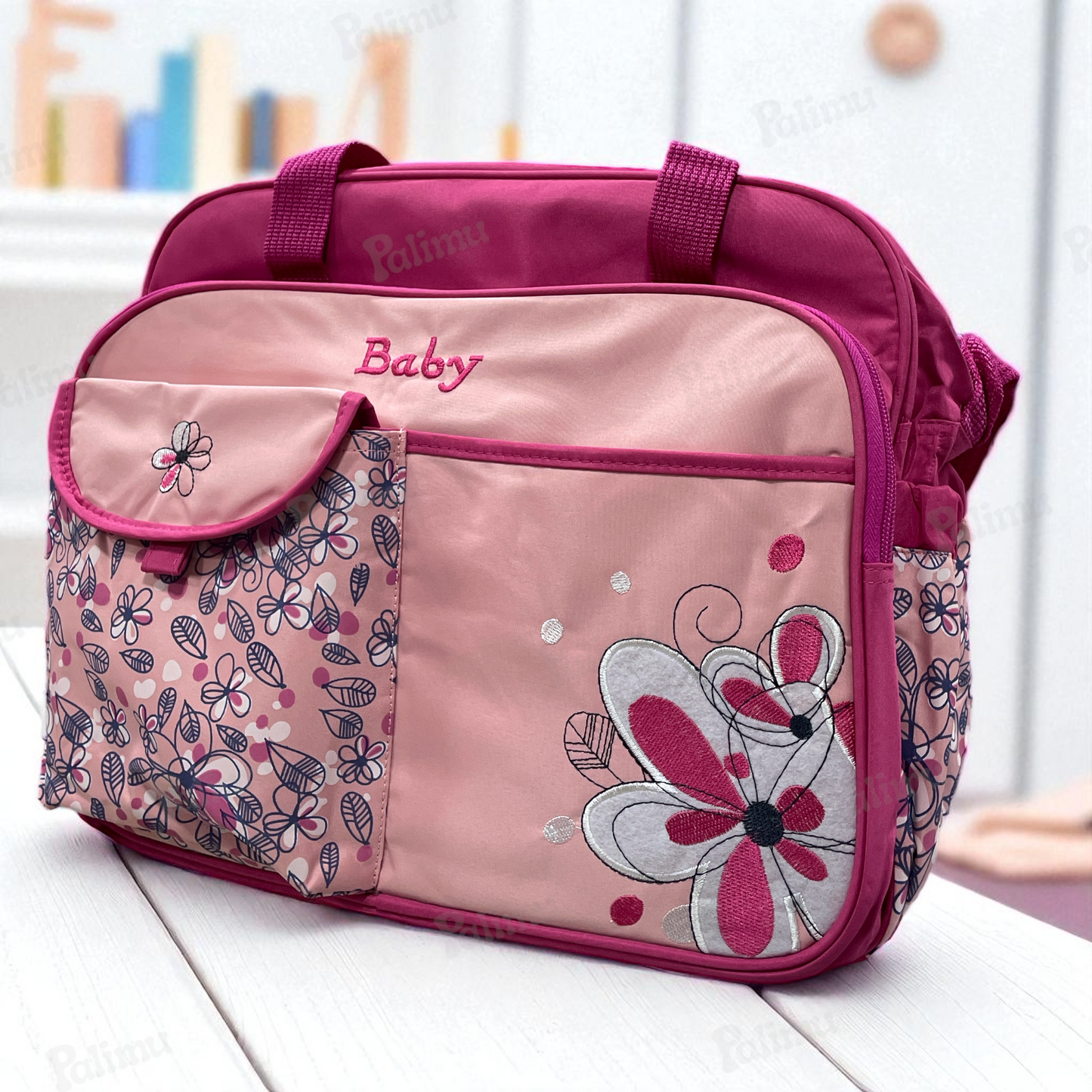 Bolso maternal floreado fucsia