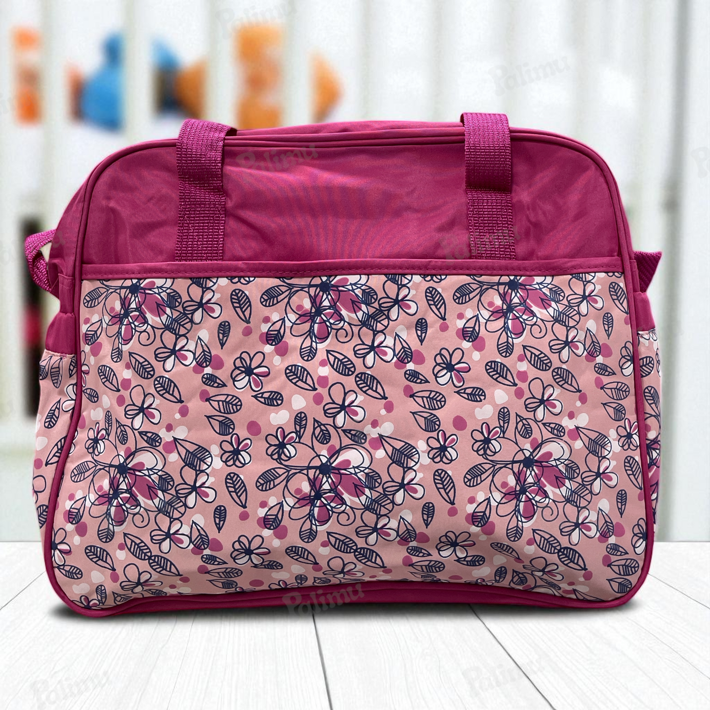 Bolso maternal floreado fucsia